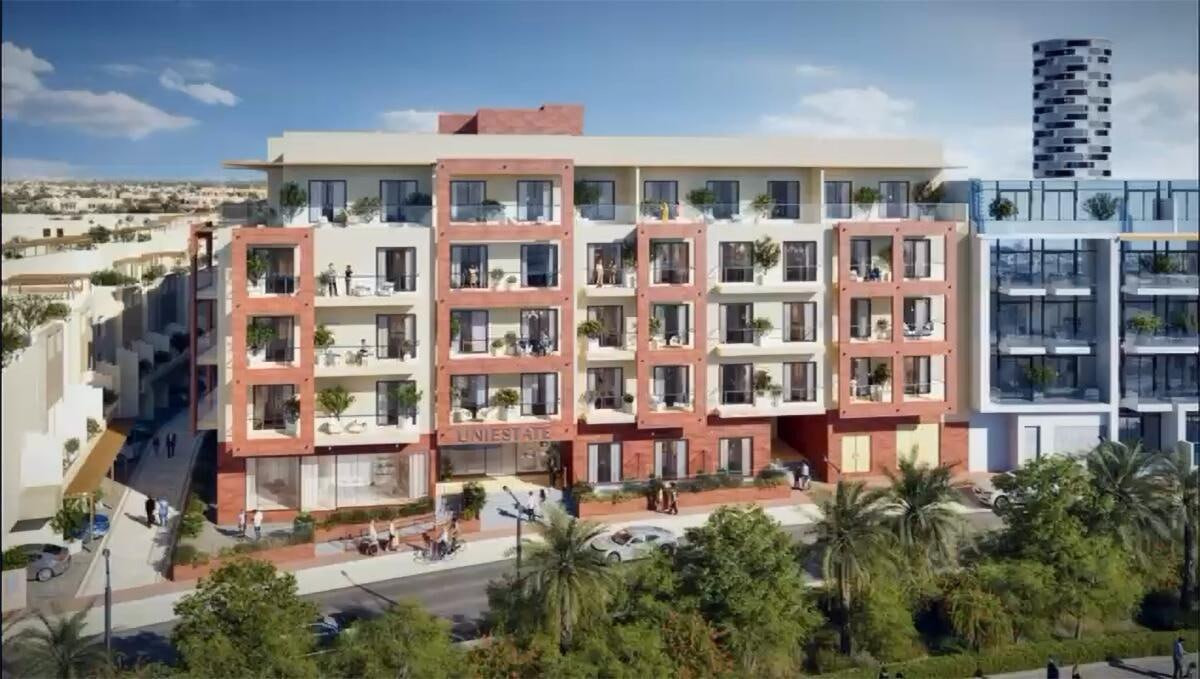 סלון ומטבח מאובזר בדירה ב-Mayfair Residences